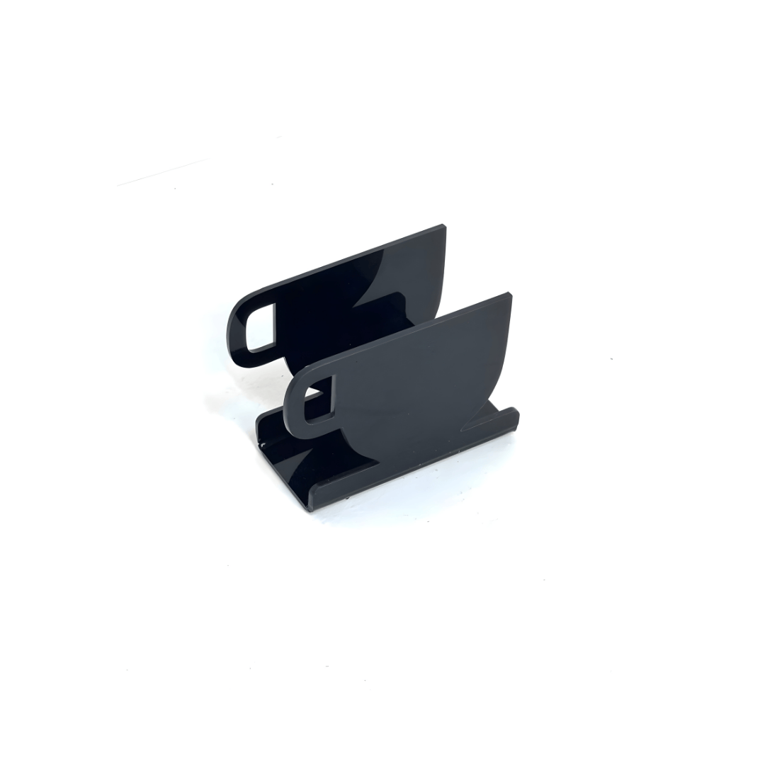 Black acrylic napkin holder on white background – modern plexi tissue stand for home, café, and restaurant use | ستاند مناديل أكريليك أسود أنيق للمطاعم والمنازل
