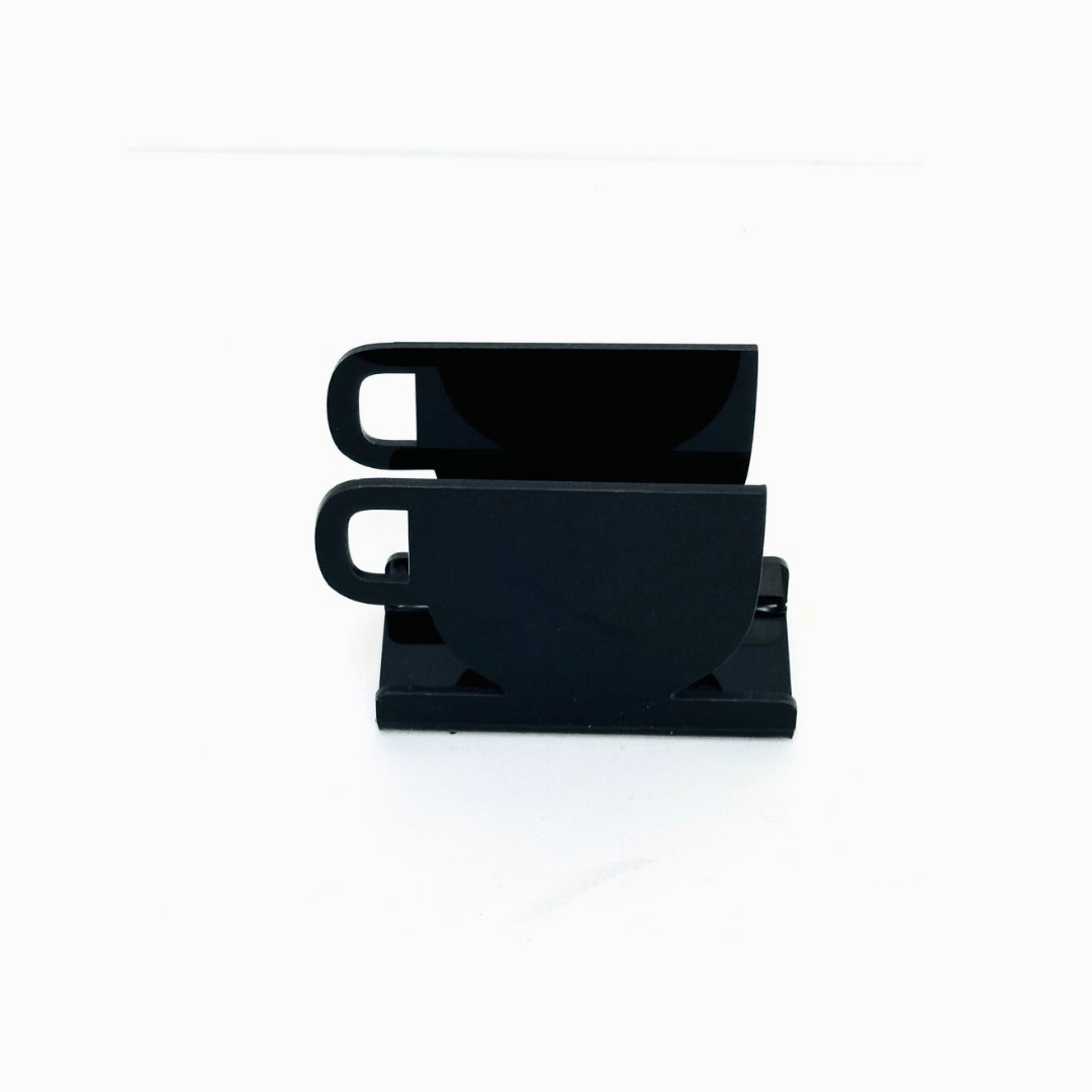Black acrylic napkin holder on white background – modern plexi tissue stand for home, café, and restaurant use | ستاند مناديل أكريليك أسود أنيق للمطاعم والمنازل
