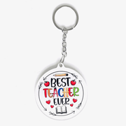 Best Teacher Ever acrylic keychain gift for teachers in Kuwait – white round design with colorful text, apples, hearts, and book icon.